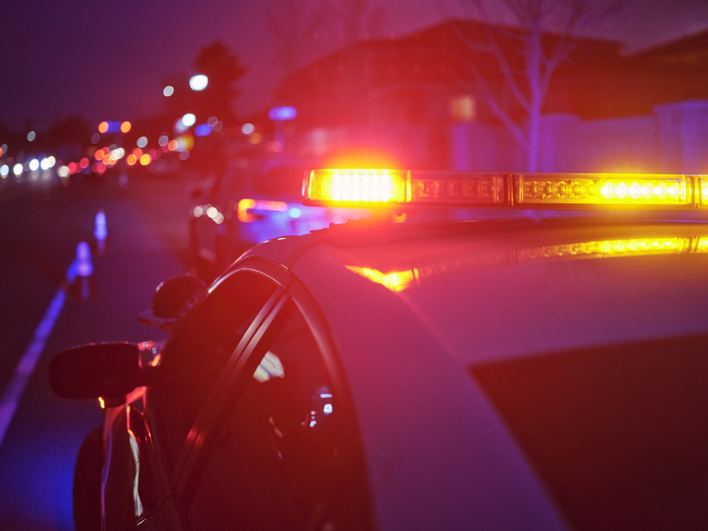Police vehicle with emergency lights at night