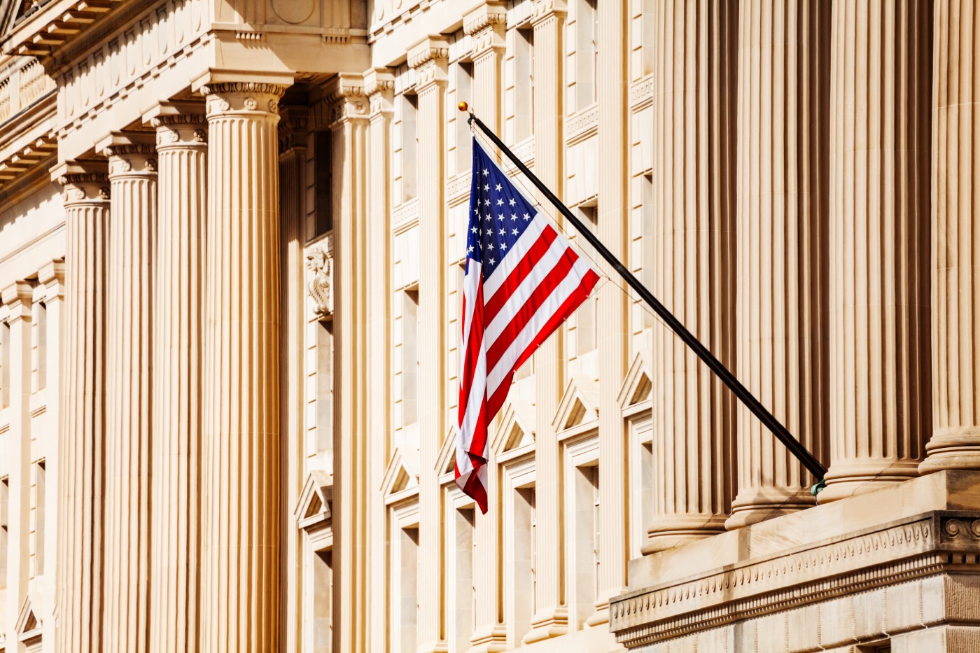 American flag on a federal government building facade